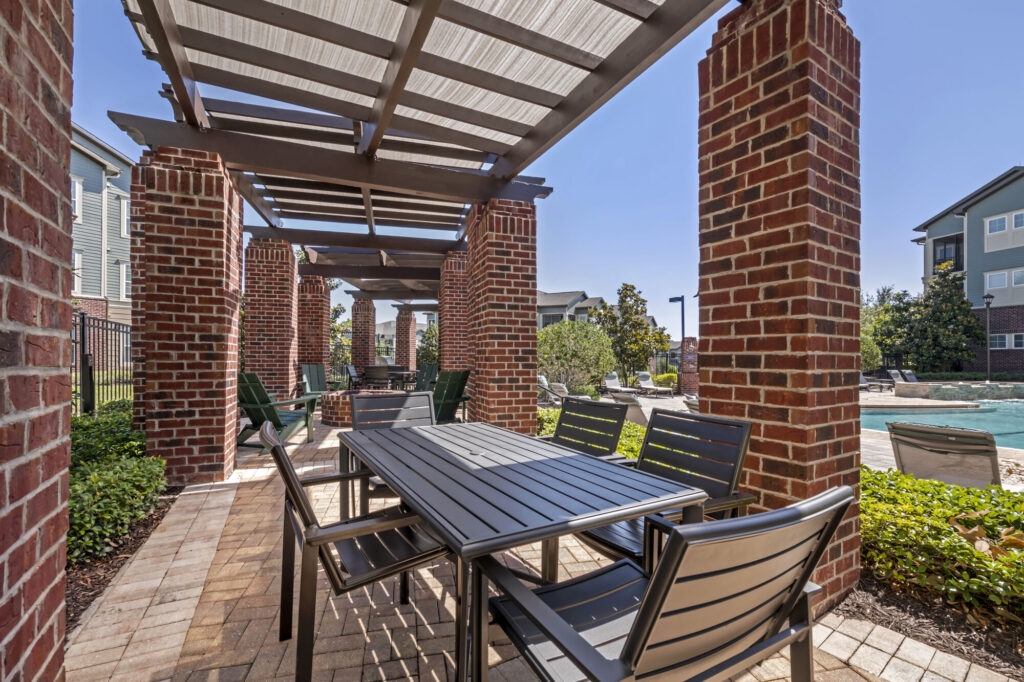 covered outdoor dining and fire pit
