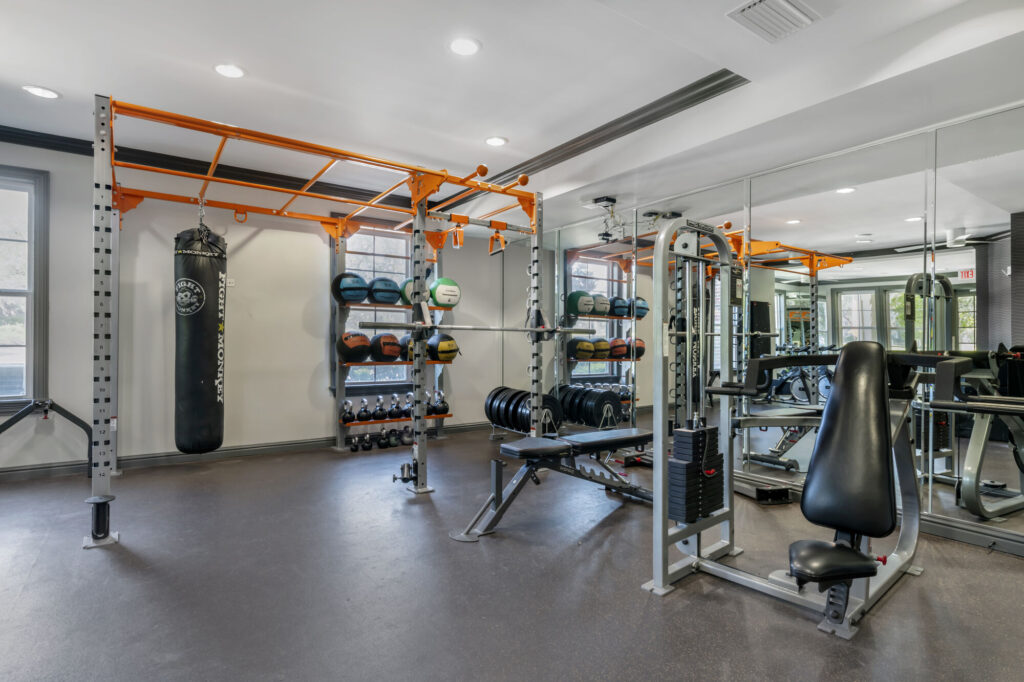 Fitness center with cardio machines, functional training, and strength training equipment